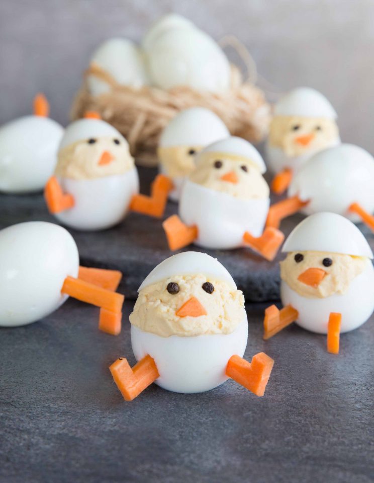 Deviled Egg Chicks with Hard Boiled Eggs in the background in a nest.