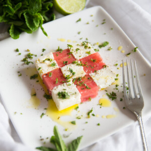 Watermelon and Feta Salad cubes with mint and fork