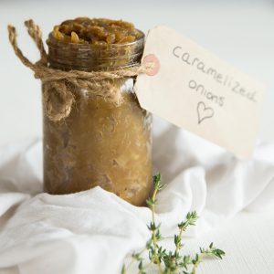 caramelized onions in a jar with string and a label