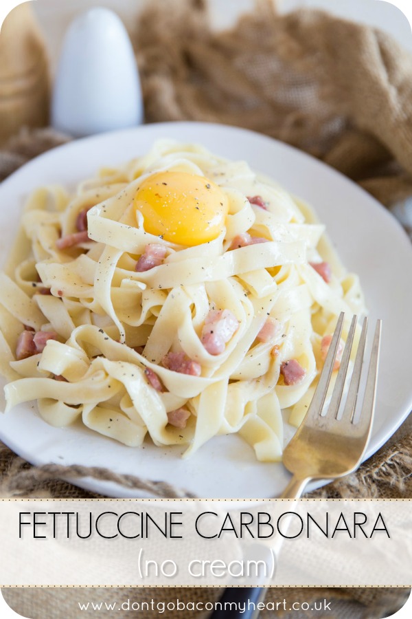 Inspired by a classic carbonara recipe, this Fettuccine Carbonara No Cream is served with an egg yolk for a rich and delicious modern twist! #pasta #carbonara #fettuccine | www.dontgobaconmyheart.co.uk