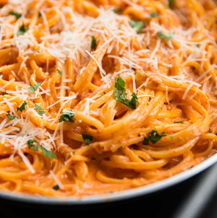 close up shot of linguine roasted red pepper in the saucepan