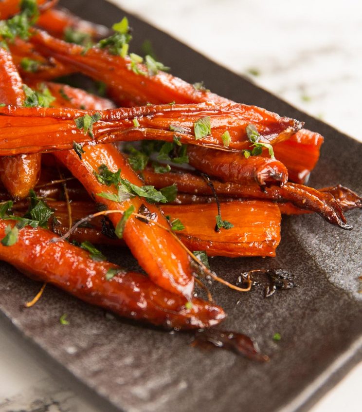 closeup shot of carrots on serving dish garnished with parsley