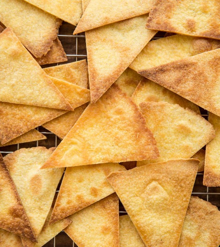 overhead shot of tortilla chips fresh out the oven on a wire rack