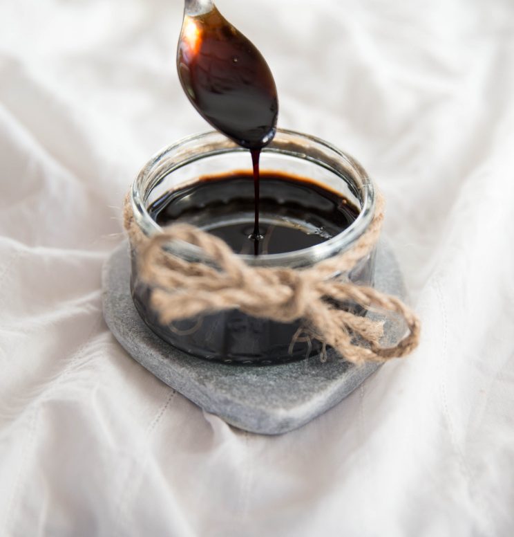 drizzling balsamic glaze with a tsp into glass jar