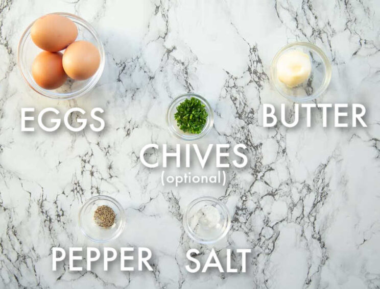 overhead shot of scrambled eggs ingredients with text labels