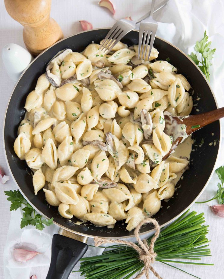 Creamy Mushroom Pasta Overhead shot of Creamy Mushroom Pasta in the Skillet with garnish around