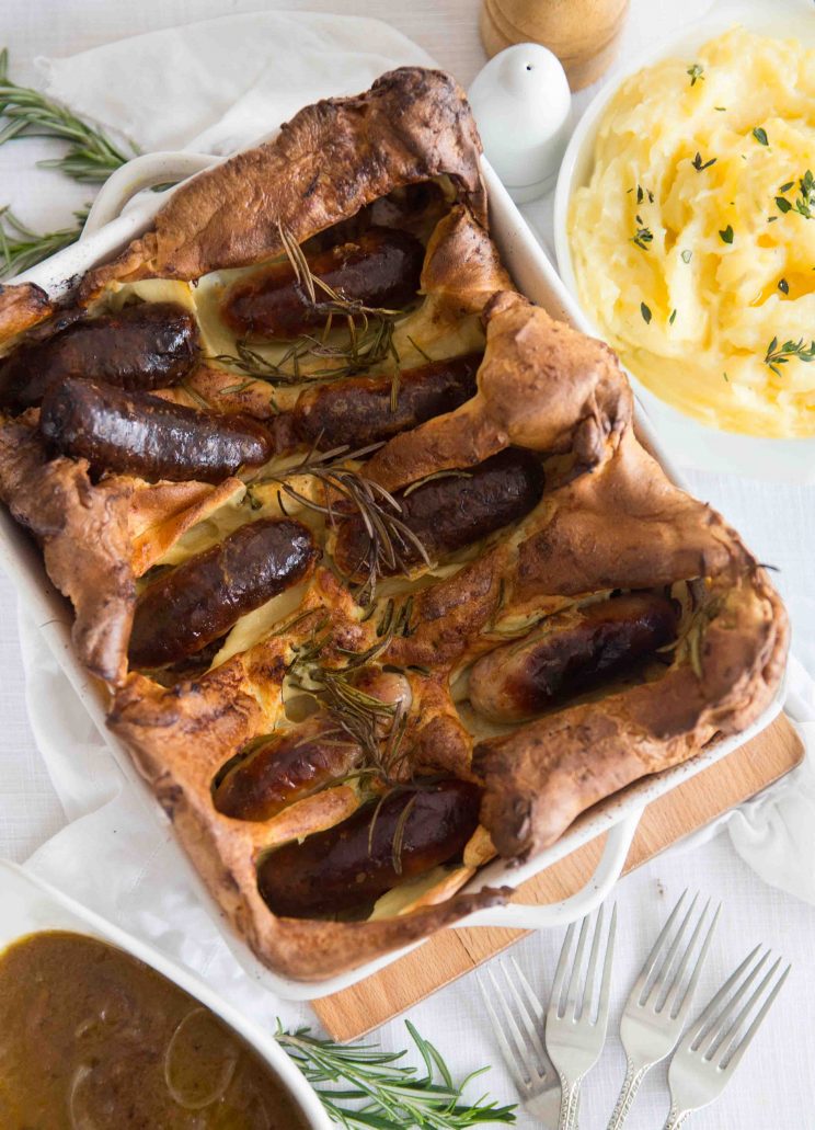 overhead shot of Toad in the Hole with Dijon Mash Potato and Red Wine Onion Gravy