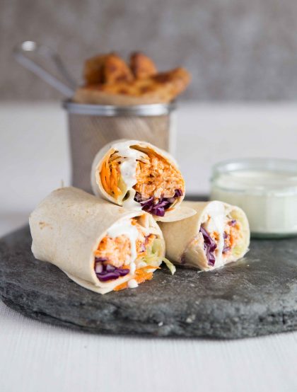Shredded Buffalo Chicken Wraps with blue cheese sauce and potato wedges