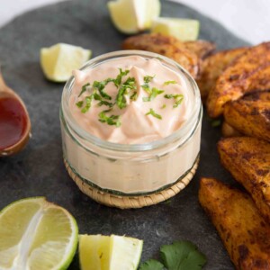 Sriracha Lime Mayo next to baked potato wedges
