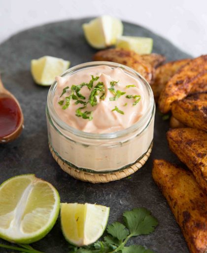 Sriracha Lime Mayo next to baked potato wedges