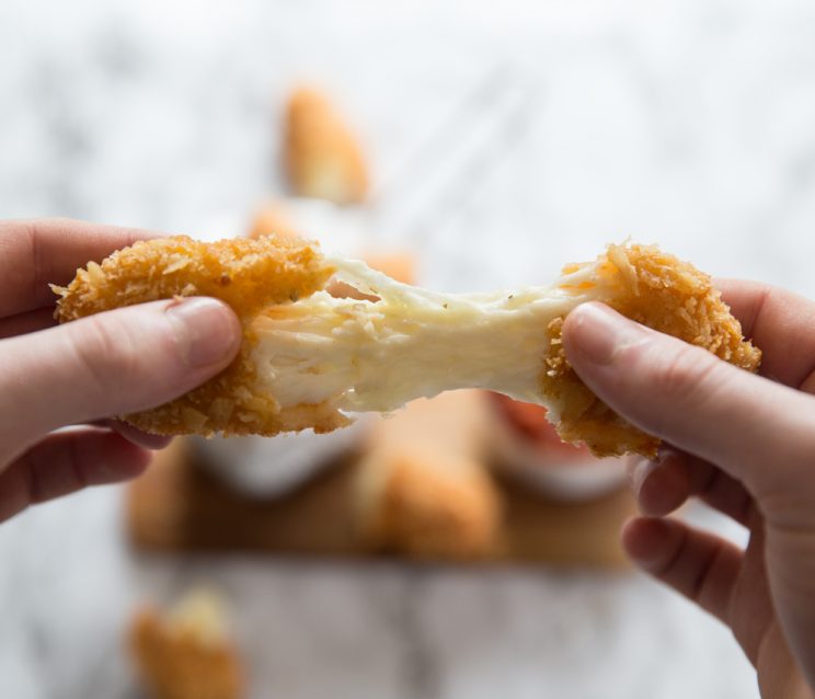 closeup shot of halloumi fries cheese pull