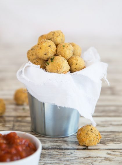 Fried Cheese Balls in a bucket with marinara dip