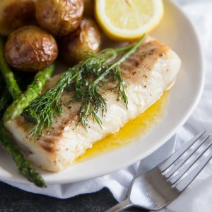 Pan Fried Cod with brown butter sauce, new potatoes, lemon and asparagus