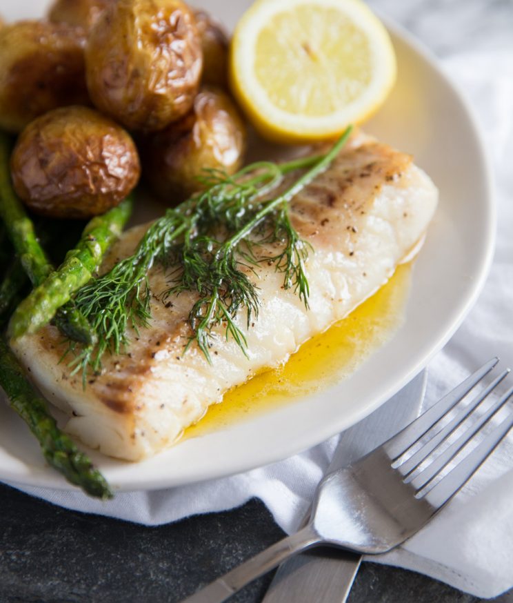Pan Fried Cod with brown butter sauce, new potatoes, lemon and asparagus