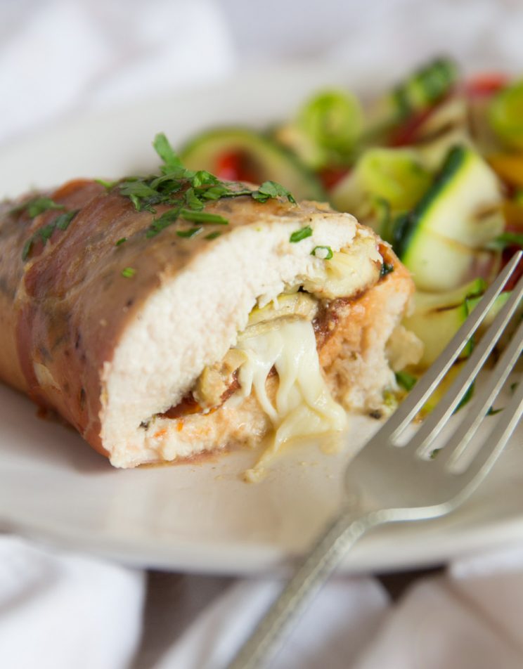 Antipasto Stuffed Chicken with cheese pouring out