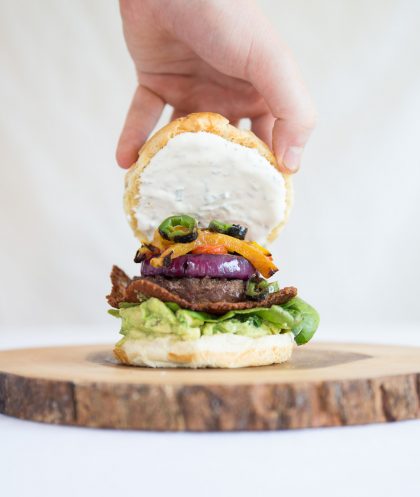 Mexican Cheeseburger with grilled peppers and open bun