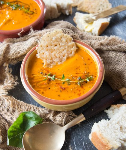 Roasted Tomato Soup with Fresh Tomatoes and Basil with bread and parmesan in the bowl
