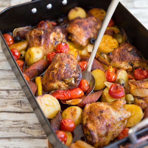 tray bake fresh out the oven with metal serving spoon digging in