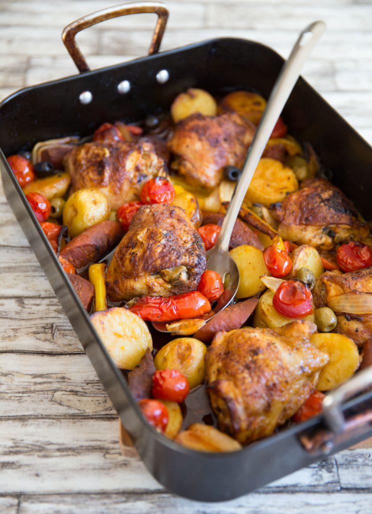 tray bake fresh out the oven with metal serving spoon digging in