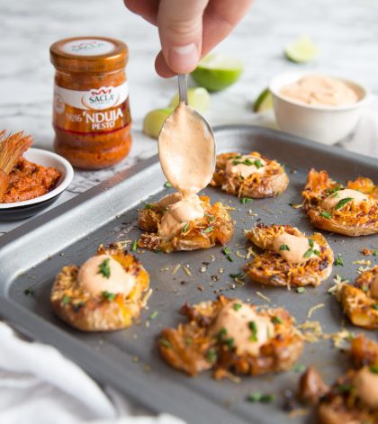 Crispy Smashed Potatoes with Pesto and parmesan with sauce