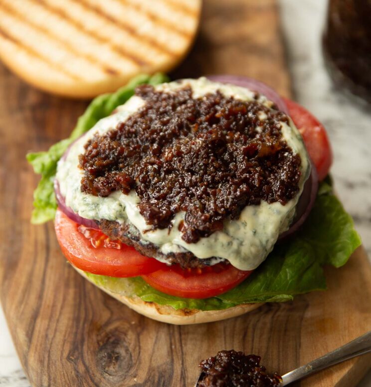 close up shot of bacon jam on blue cheese burger