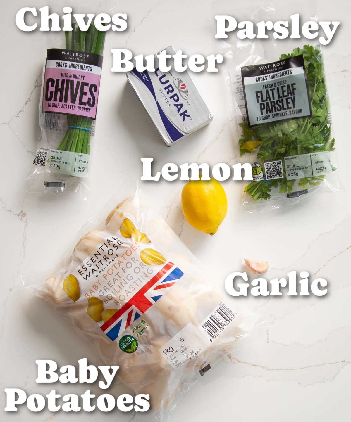 overhead shot of boiled baby potatoes ingredients with text labels