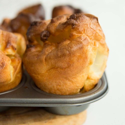 side angle shot of Perfect Yorkshire Puddings straight out the oven