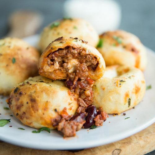 stuffed garlic dough balls with chilli pouring out