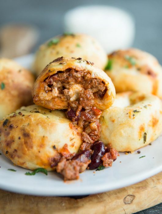 stuffed garlic dough balls with chilli pouring out