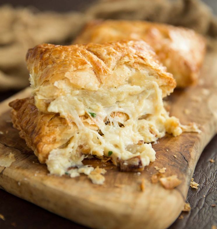 Cheese pouring out of greggs copycat cheese and onion pasty