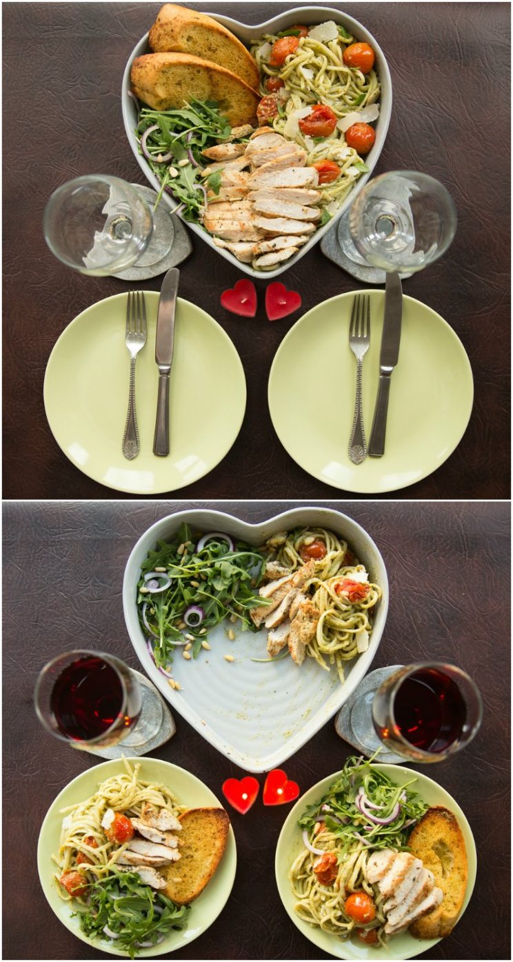 Romantic dinner setup - chicken avocado pasta with red wine, salad and garlic bread