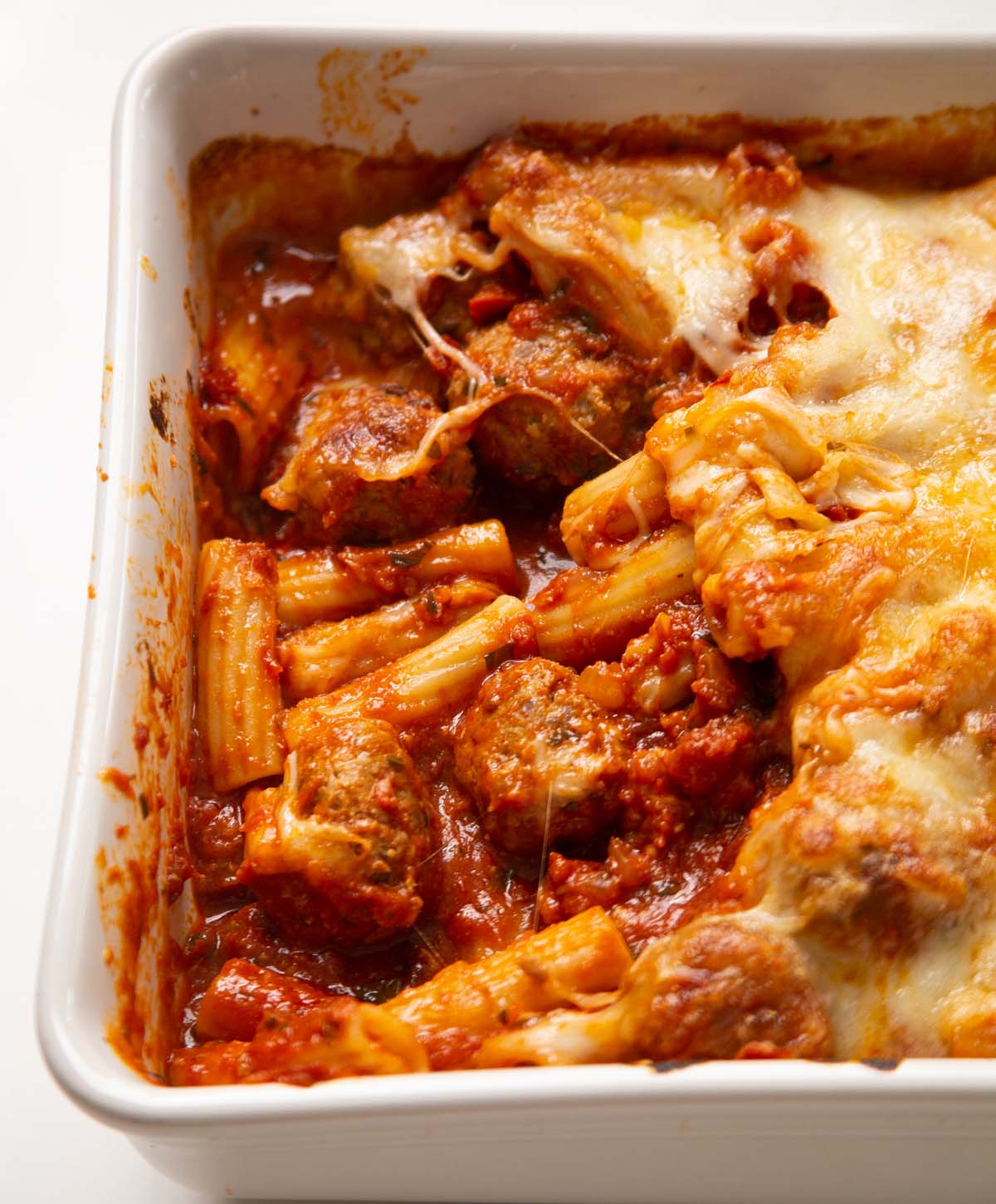 close up shot of meatball pasta bake fresh out the oven