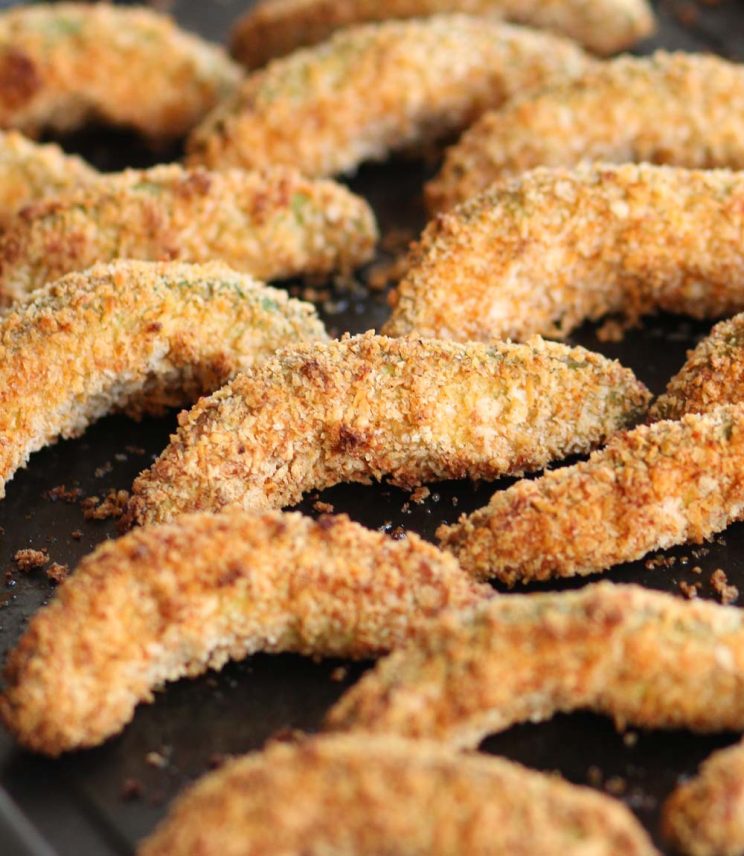 Oven Baked Avocado Fries fresh out the oven on black oven tray