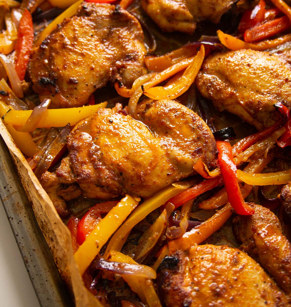 close up shot of sheet pan chicken fajitas fresh out the oven