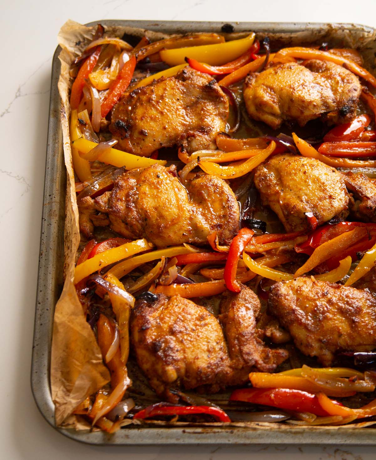 sheet pan chicken fajitas on large tray fresh out the oven