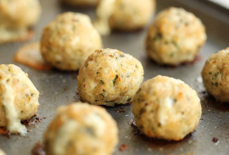 Baked Chicken Meatballs fresh out the oven on black oven tray