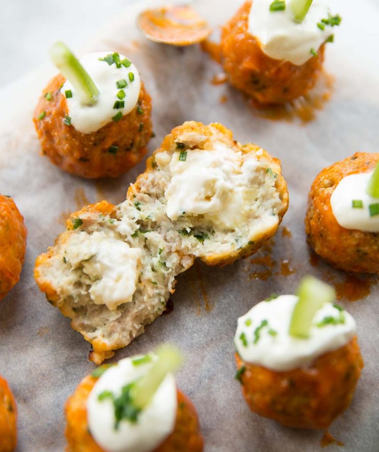 buffalo chicken meatball torn open with blue cheese pouring out