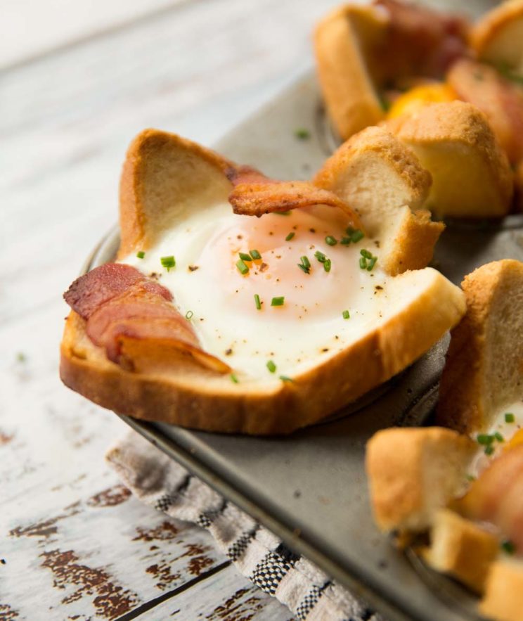 side shot of one toast cup fresh out the oven