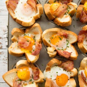 overhead shot of toast cups fresh out the oven garnished with chives