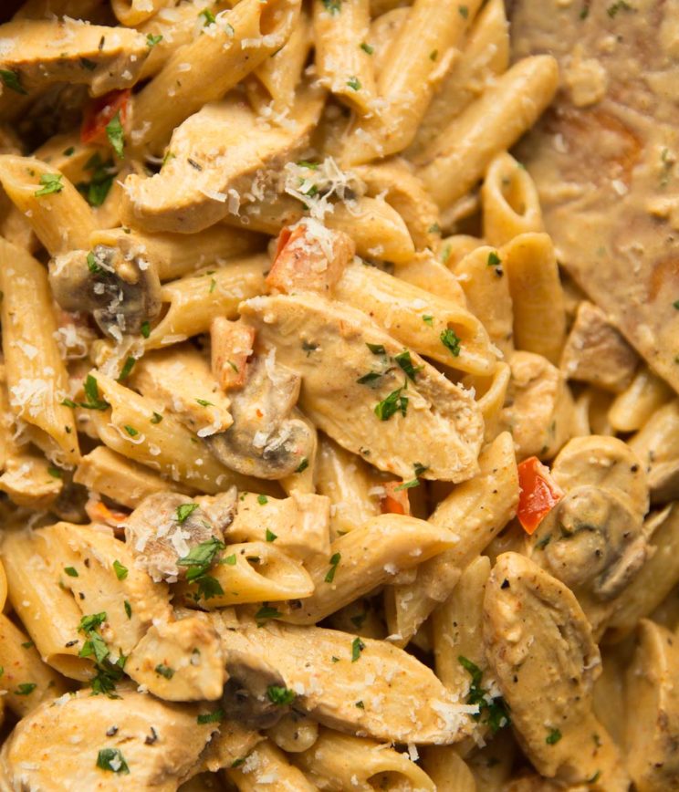 overhead shot of penne chicken pasta in skillet