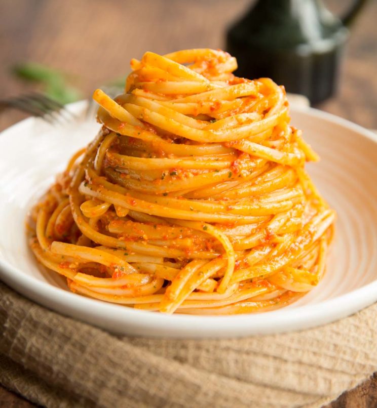Roasted Red Pepper Pesto Pasta plated up on white plate