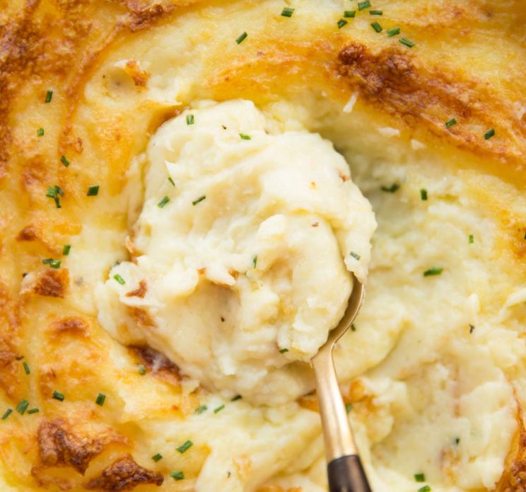 overhead shot of spoon scooping into mashed potato