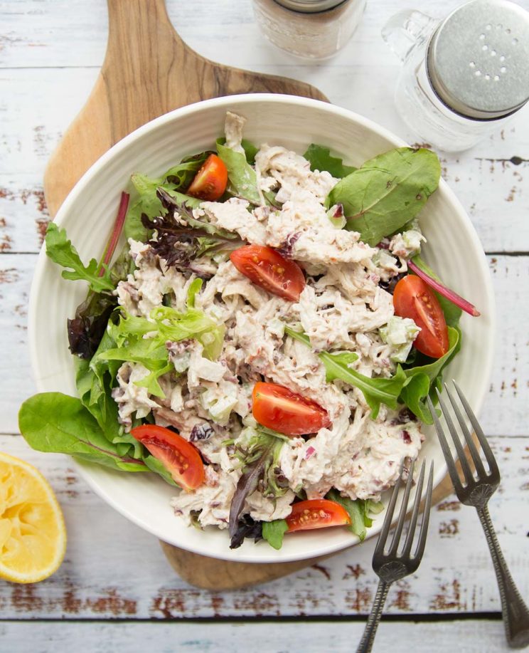overhead shot of rotisserie chicken salad with tomato chopped on top