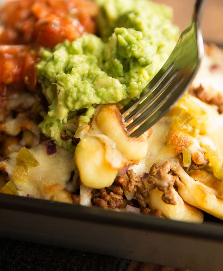 fork digging into 2 pieces of gnocchi