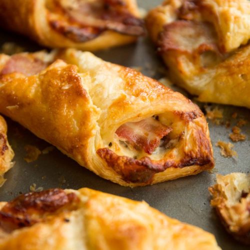 closeup over cheese and bacon turnover with focus on bacon