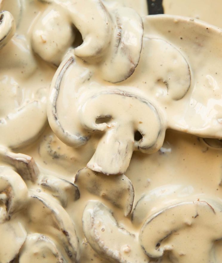 overhead shot of creamy mushrooms in skillet