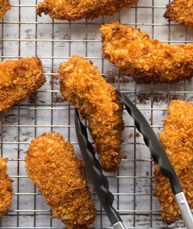 chicken tenders fresh out the oven on cooling rack 