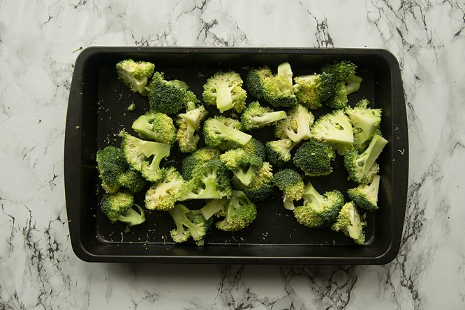 overhead shot of broccoli on tray ready for roasting