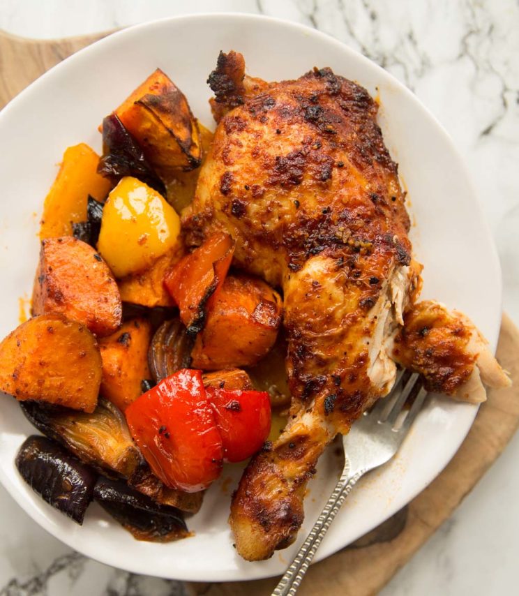 overhead shot of Roasted chicken legs plated up with veg