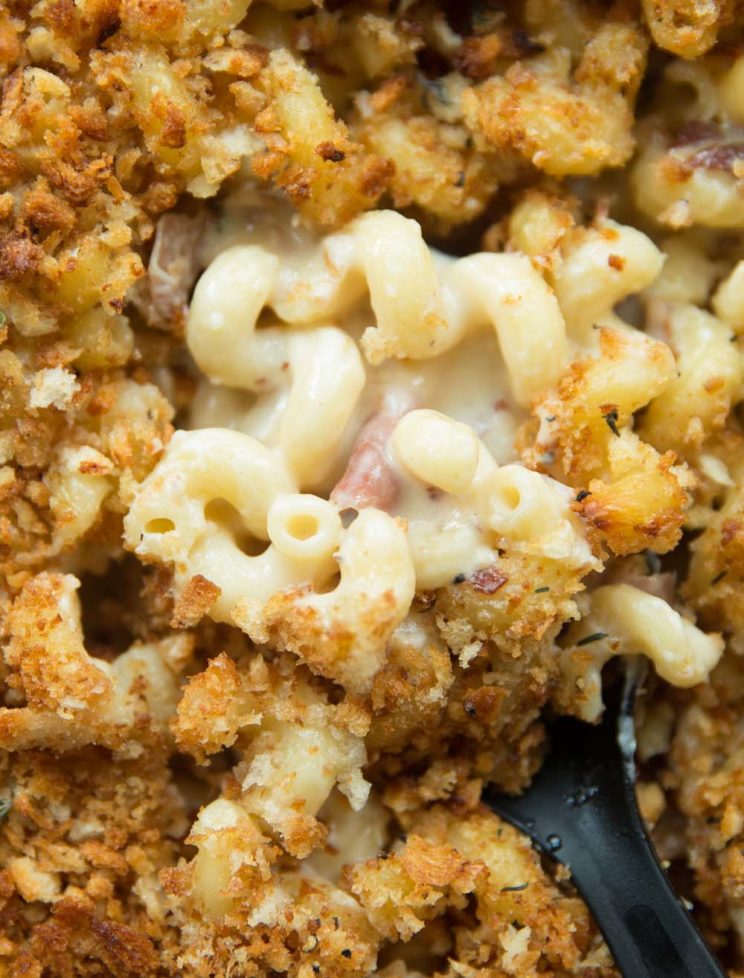 overhead shot of spoon digging into mac and cheese